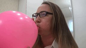 Inflating a large balloon until it explodes b