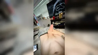 Skinny young twink strokes his big cock in solo masturbation
