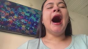 Yawns of a cute girl