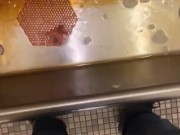 Taking a piss at an old urinal trough