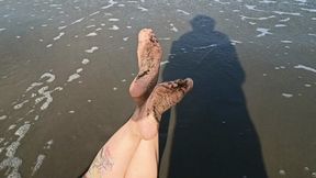 Some wrinkled and dirty soles on the beach (4)