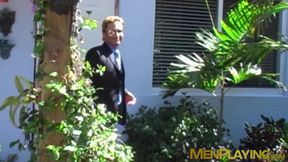 Businessman in a classy suit gets blowjob from gay buff dude