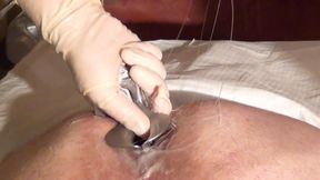 Dominatrix fists and stretches a mans asshole