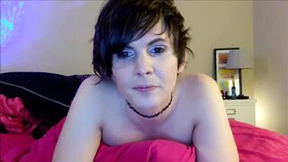 Short haired tranny shows her face of orgasm