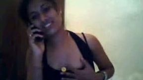 Attractive Indian girl caresses her coochie while having phone sex