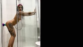 ”Inked teen gril fucking her sex toy in the shower”