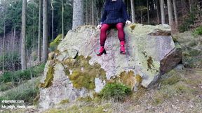 In the forest with high heels and red pants