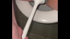 Filthy slut licks public toilet in the hotel and plays with toilet brush