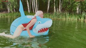I play and swim in a big inflatable ring on the lake