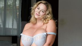 An awesome big-boobed BBW Holly Garner plays with her shaved pussy