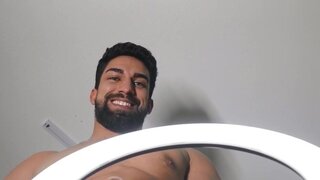 Bearded man making an OnlyFans video with his partner