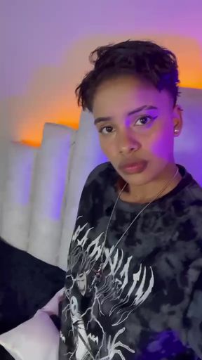 Tomboy Latina lesbian amateur shows natural tits in this solo scene