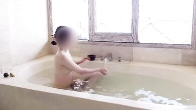 Age gap couple bathing in the resort bath.