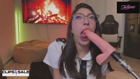 Flight attendant on her knees sucks a large dildo