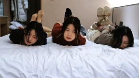 Three curious girls experience rope bondage for the first time in a hotel