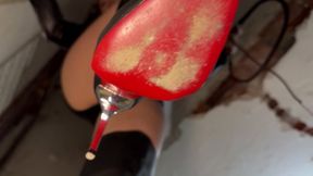 Under the Queen's Heel: Domination in high boots and red soles.