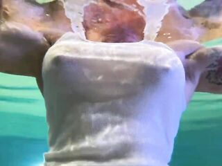 Amazon Kandy Flexes Her Biggest Biceps in Her Hotel Pool