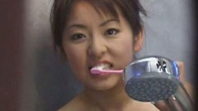 Cute Japanese busty babe in the bathtub feeding on dick