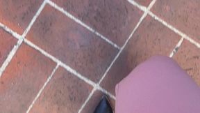 Feet rubbing hard in her pant suit