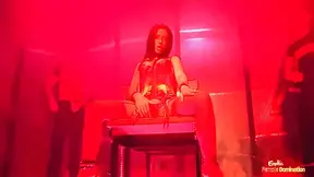 Bound Babe Strokes Off Two Hard Cocks And Gets Fucked While In A Red Corset