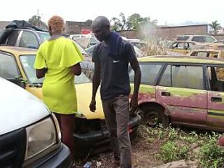 The mechanic has sex with his female customer in the garage whilst her vehicle is being repaired.