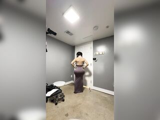 Sexy trans in her hot gray suit teasing her giant boobs and booty