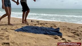 Beach Babe loses bet in public strip tic tac toe game