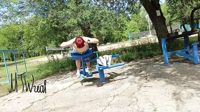 Redhead flashes her pussy while working out in a tiny skirt