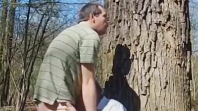 Naughty grandpa is being fucked in the ass in the woods