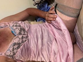 Super sexy pink slip nighty. With silver stockings and high heels. I rub my cock and I have a surprise outfit underneath.