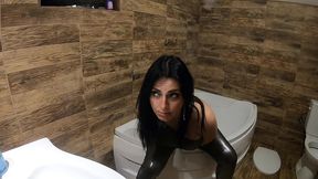 ripped shiny nylon jumpsuit in the bathroom. cum cleanup, dirty dancing and pee play