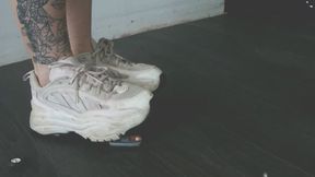 Giantess goddess Charlie Caroline Crushes a 1981 Toyota Celica in big white chunky trainers left close up view