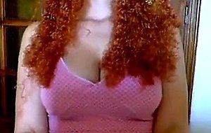 busty readhead with curly hair