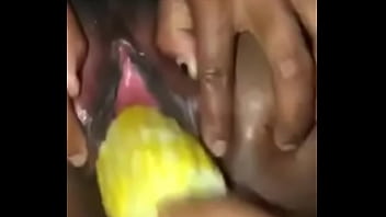 ebony girl gets her pussy stretch with a corn