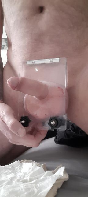 Squeezing testicles