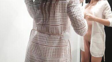 Girl changes clothes in a fitting room