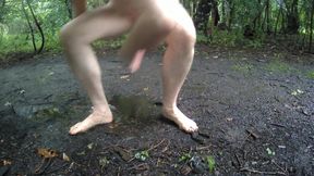Jonathan outside strips naked walks and runs around wanking, it rains he sits wet in a muddy puddle masturbating