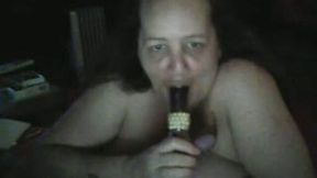Ugly mature fattie sucks a dildo in webcam solo scene