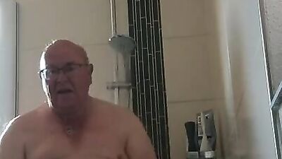 Perverted grandpa is playing with his genitals inside the motel