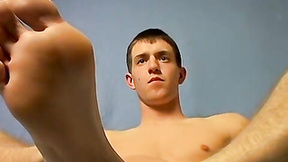 Kinky gay twink loves to put cream on his meat & feet