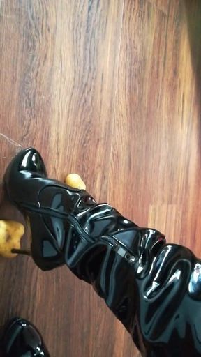 The lady in beautiful boots crushes potatoes