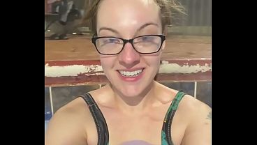 Busty brunette milf showcases her all-natural body in a swimsuit during a