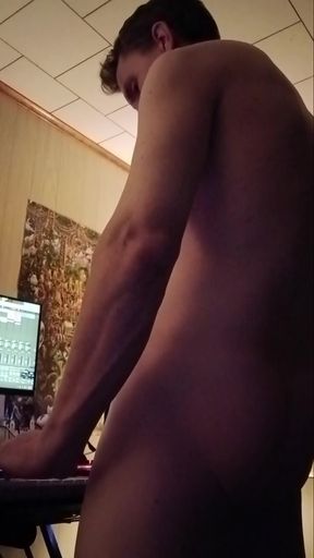 Shirtless man playing guitar