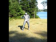 armed zentai skeleton outdoors in the sun