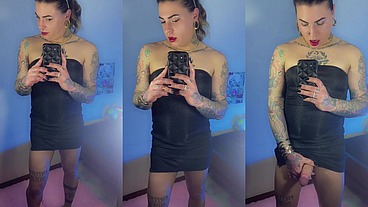 Trans girl Emma Ink shows off in the mirror in high heels and a short dress. Without panties his big dick was loose