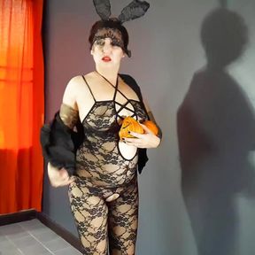 A very sexy witch in erotic lingerie. red-haired Playboy witch. Perfect pussy. I would fuck this chick! Adult halloween costume.