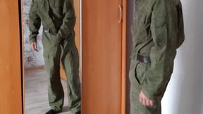 A Russian soldier in military uniform and dirty socks jerks off his dick