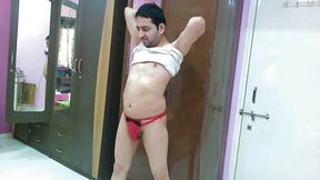 Sexy sissy crossdresser femboy Sweet Lollipop in a chime, thong, sunglasses and flip-flops.