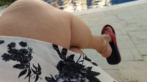 Channels hanging from Angelin's feet while in front of the pool (1)