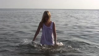 Divine Blonde Teen Blissfully Naked in the Sea
